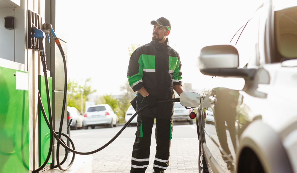 Pump Man Putting Fuel in The Vehicle